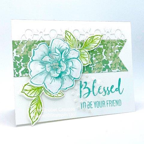 Coastal Cabana and Soft Sea Foam are featured on this To A Wild Rose stamp set. After stamping both the flower and the leaves I took a wet waterpainter and just pulled some of the ink from the image into the white space of the flower petals and leaves. Use the coordinating dies for the detailed white strip and Basic Pearls for the flower center. The white Polka Dot Tulle Ribbon is my favorite because of it's transculent appearance. Don't miss out on more Wild Rose inspiration here : https://www.pamstrobelcreates.com/to-a-wild-rose-stamp-set