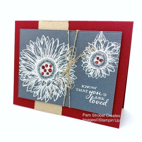 This White embossed Celebrate Sunflowers stamp set features Cherry Cobbler, Basic Gray and Crumb Cake colors. Holiday Rhinestones were used to pull the Cherry Cobbler color into the centers o fthe flowers. Linen thread gets wrapped around the panel for a rustic feel.